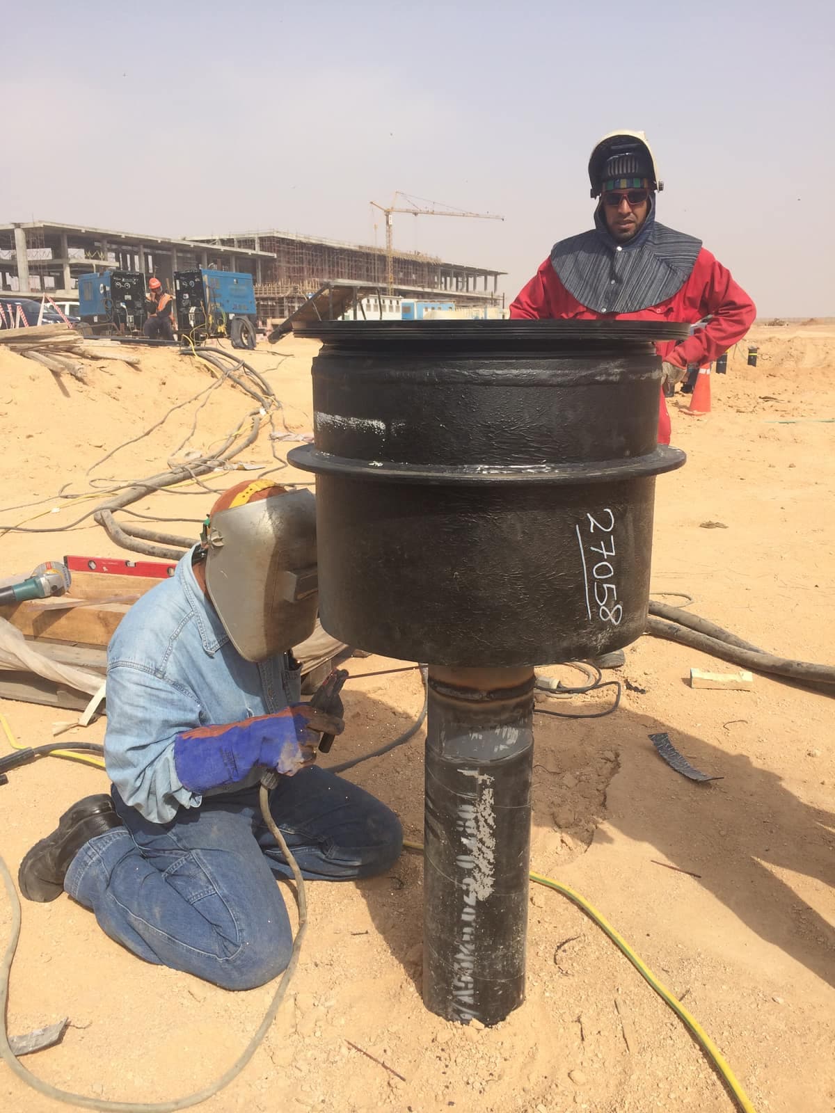 An operator welding a branch connection on the hydrant main at Cairo Airport